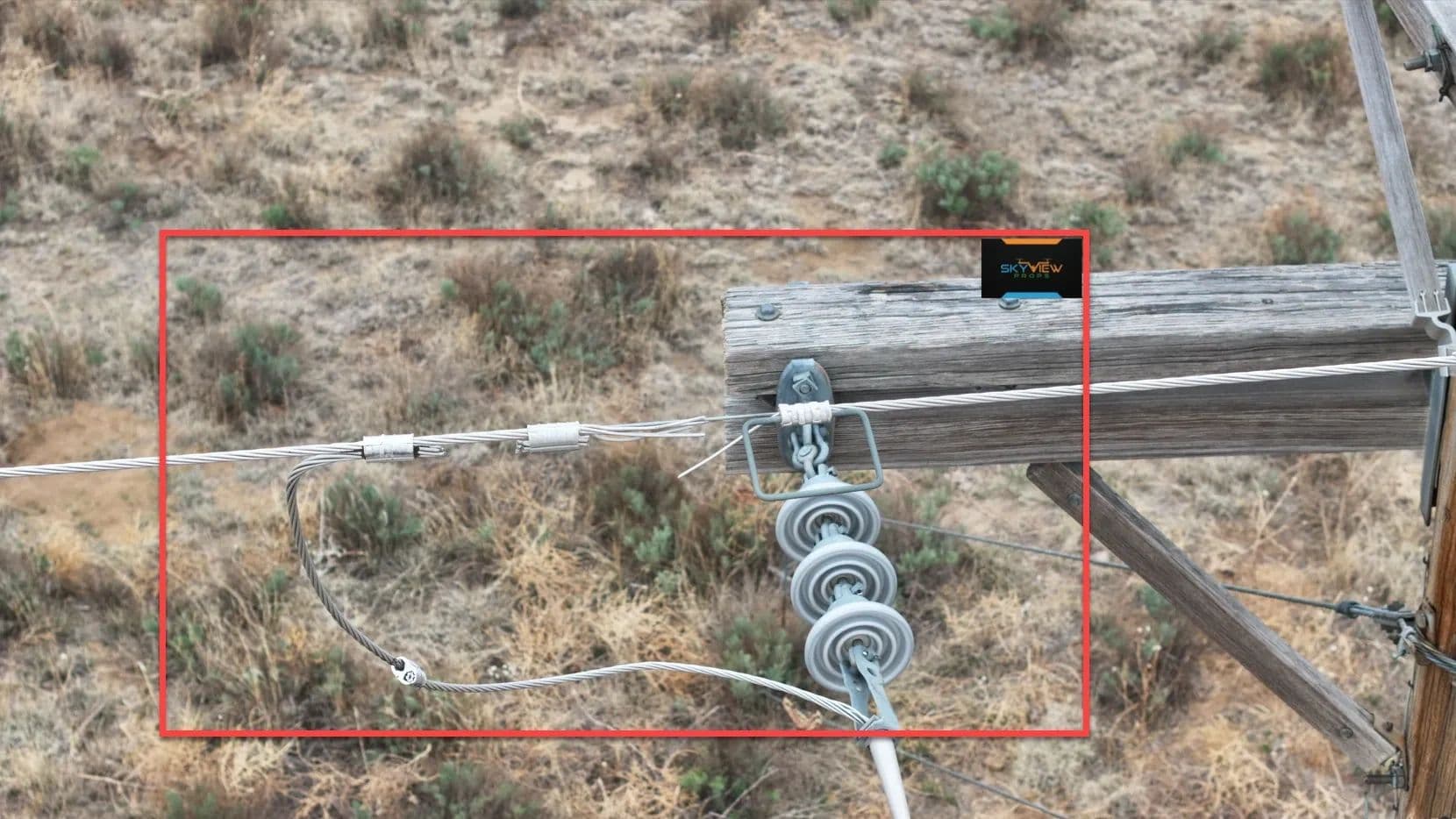 Annotated aerial image identifying power pole hardware condition