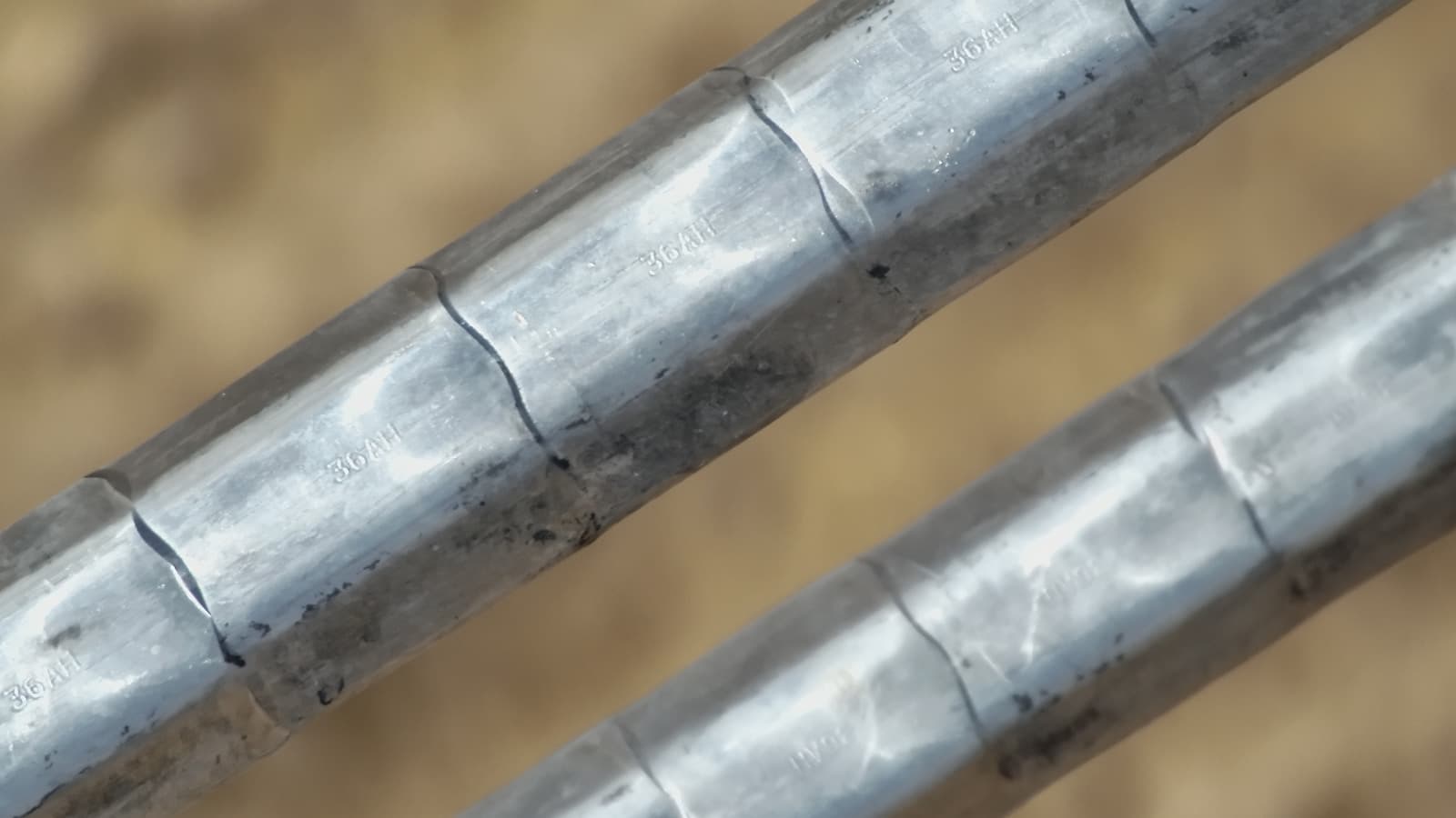 Close detail of compression sleeves showing die impressions after construction